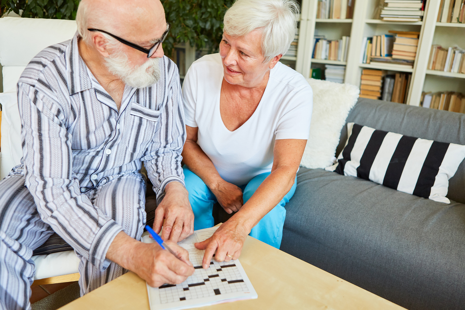 Couple filling a cross word