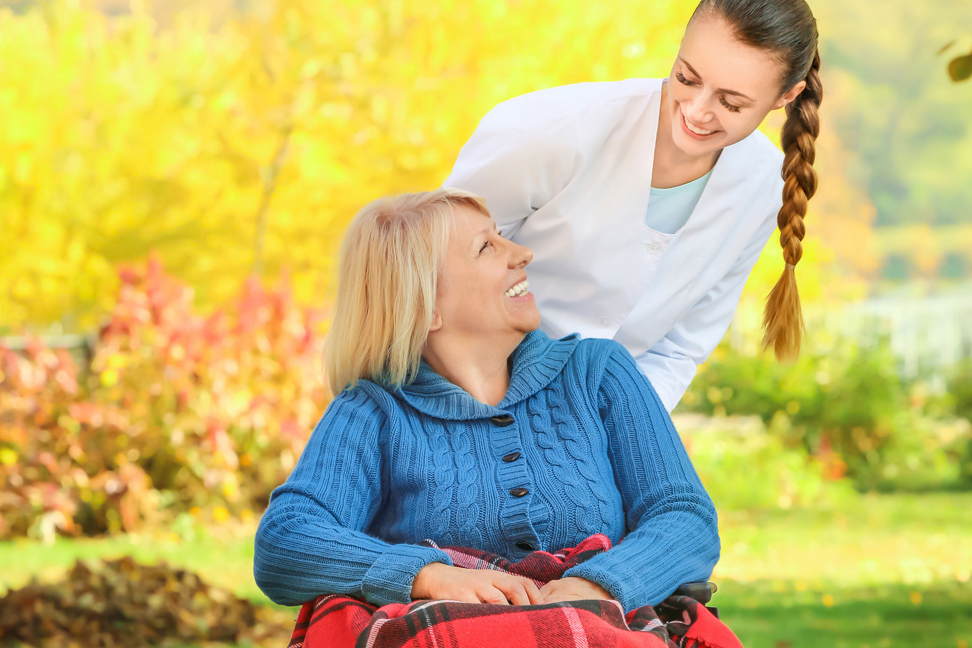 Nurse helping patients participate in Halloween activities 