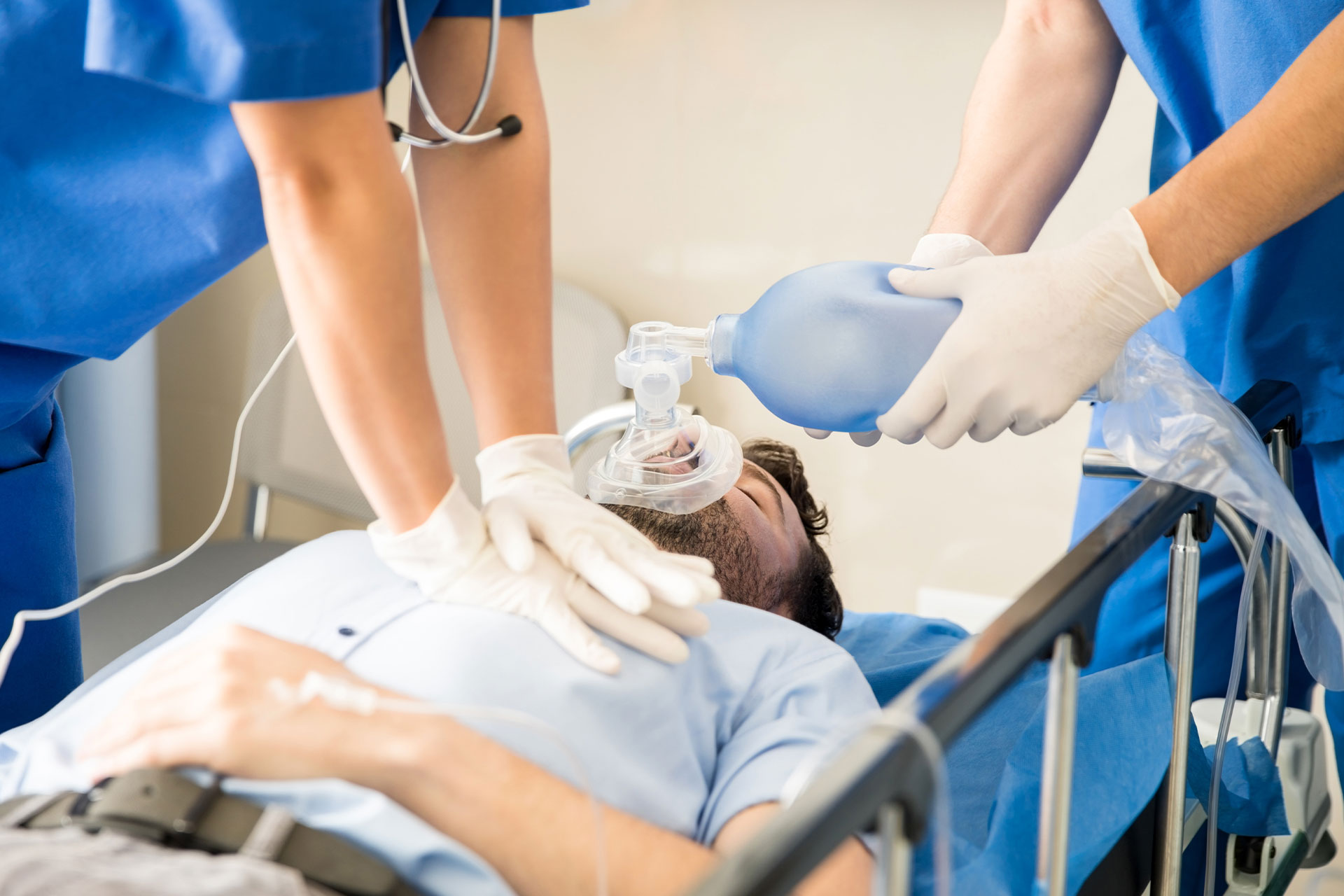 nurse performing cpr on patient