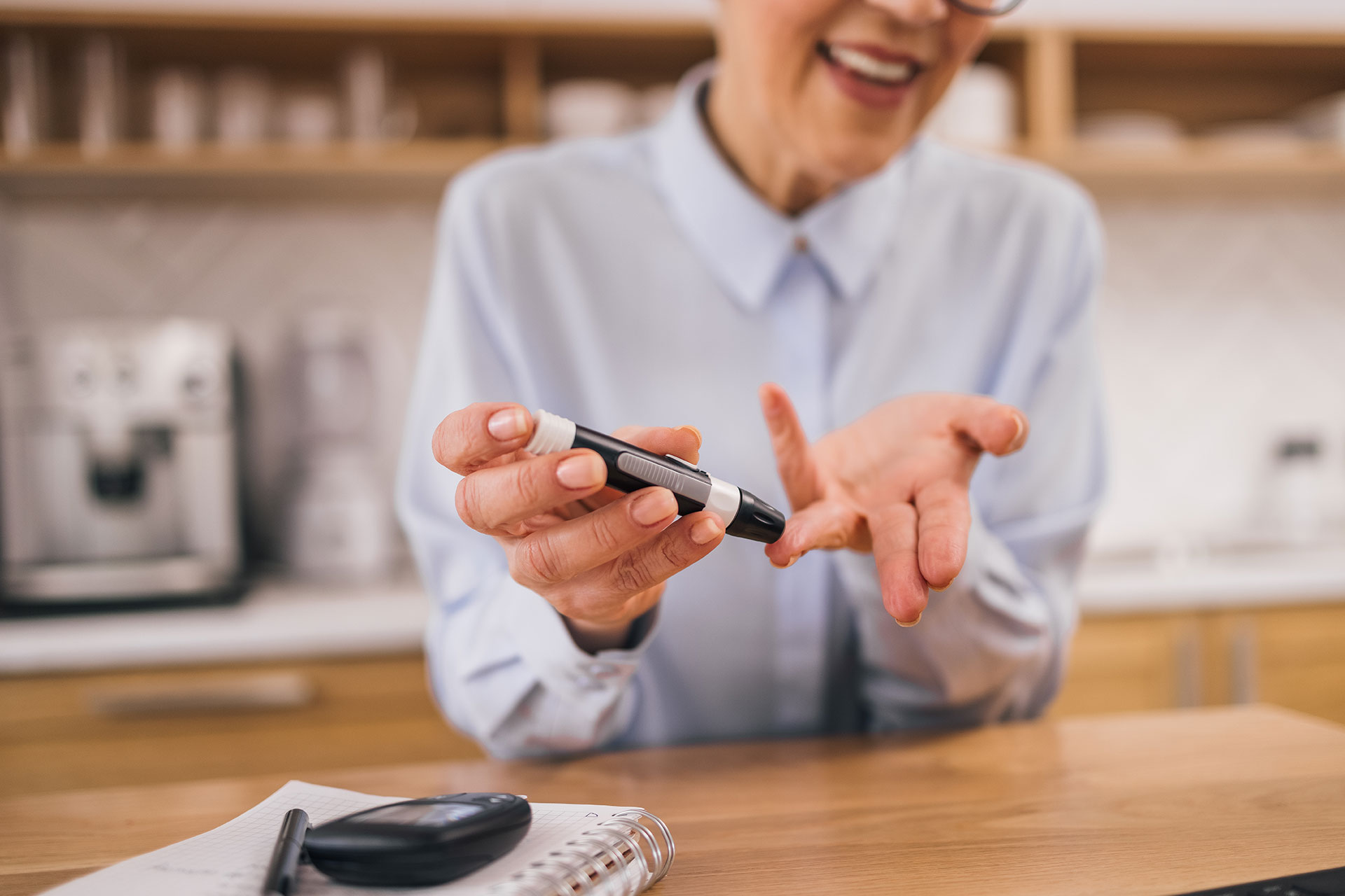 Nurse taking glucose levels for patient