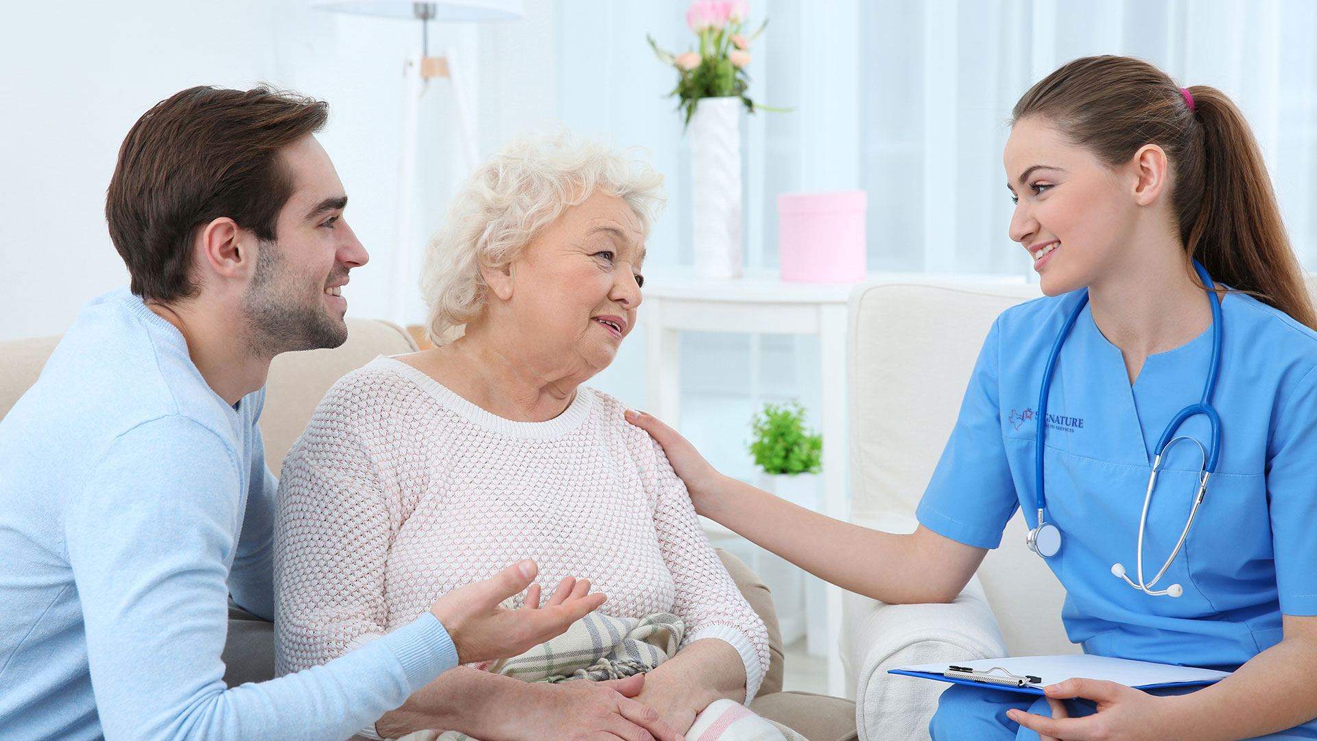 Nurse talking to patient and her family
