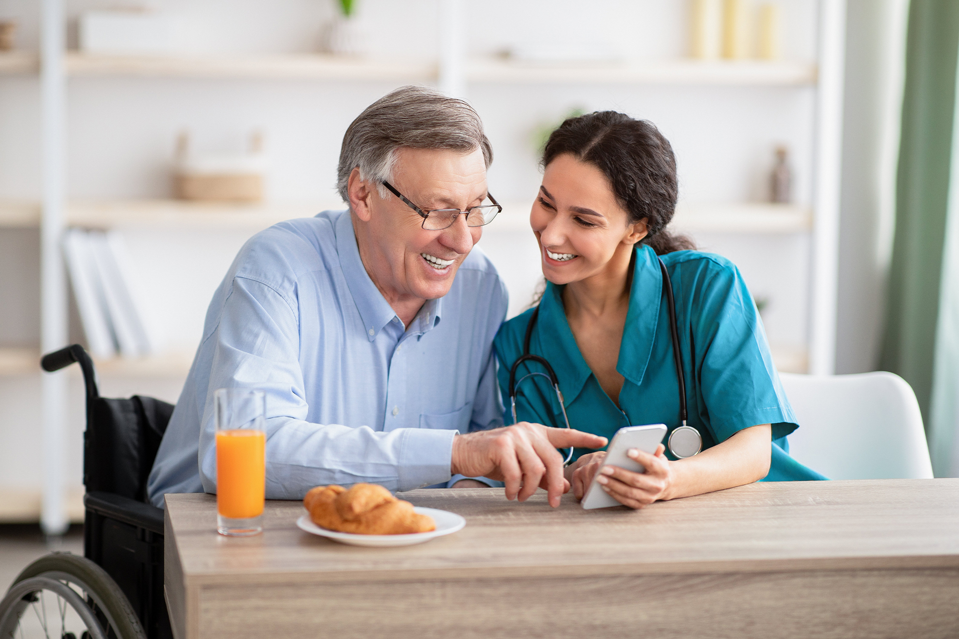 Nurse and patient looking at the phone