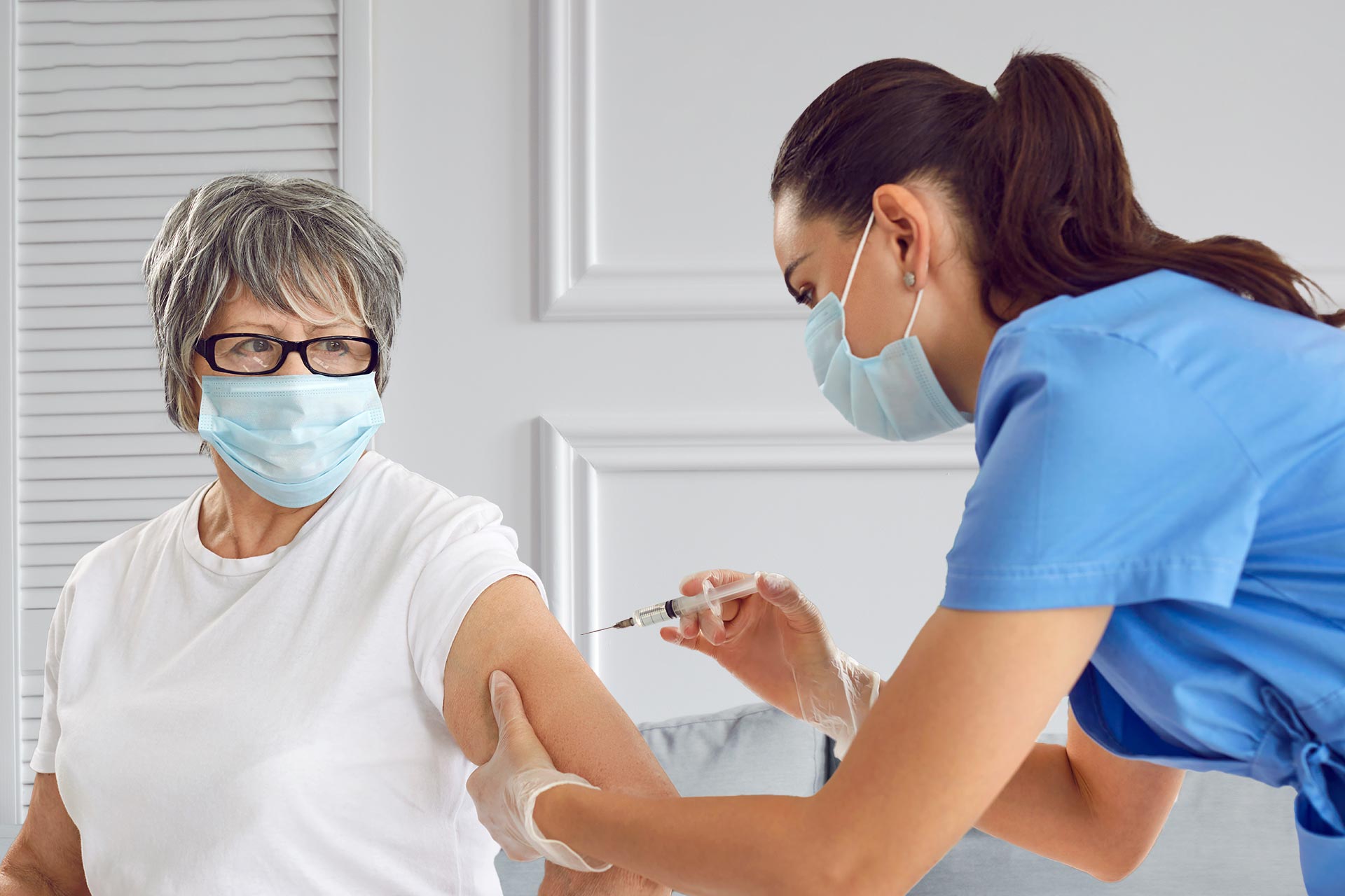 Nurse giving a vaccine to a women in Houston