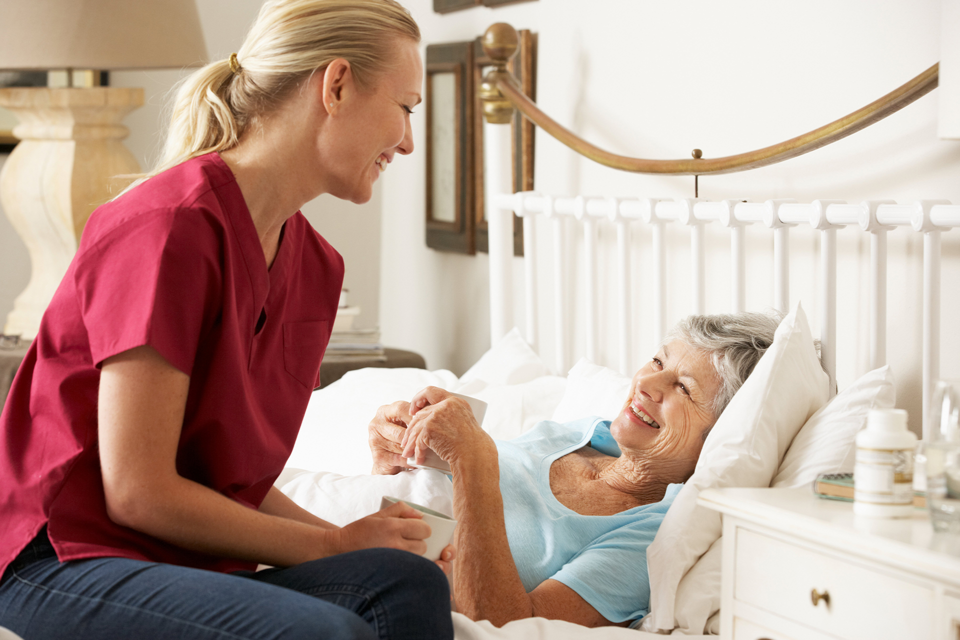 patient and skilled home nurse laughing