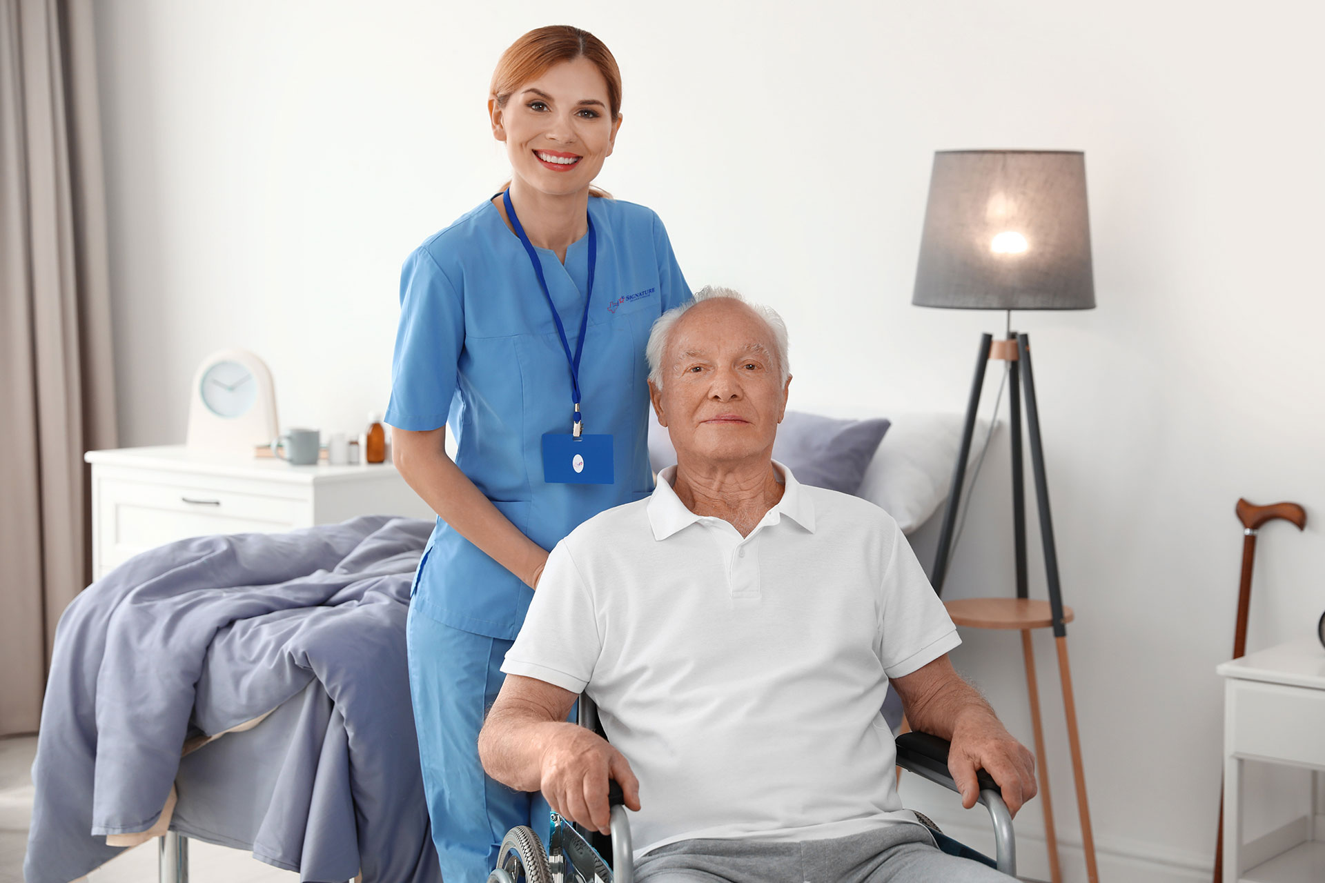 Medical assistant caring for male patient