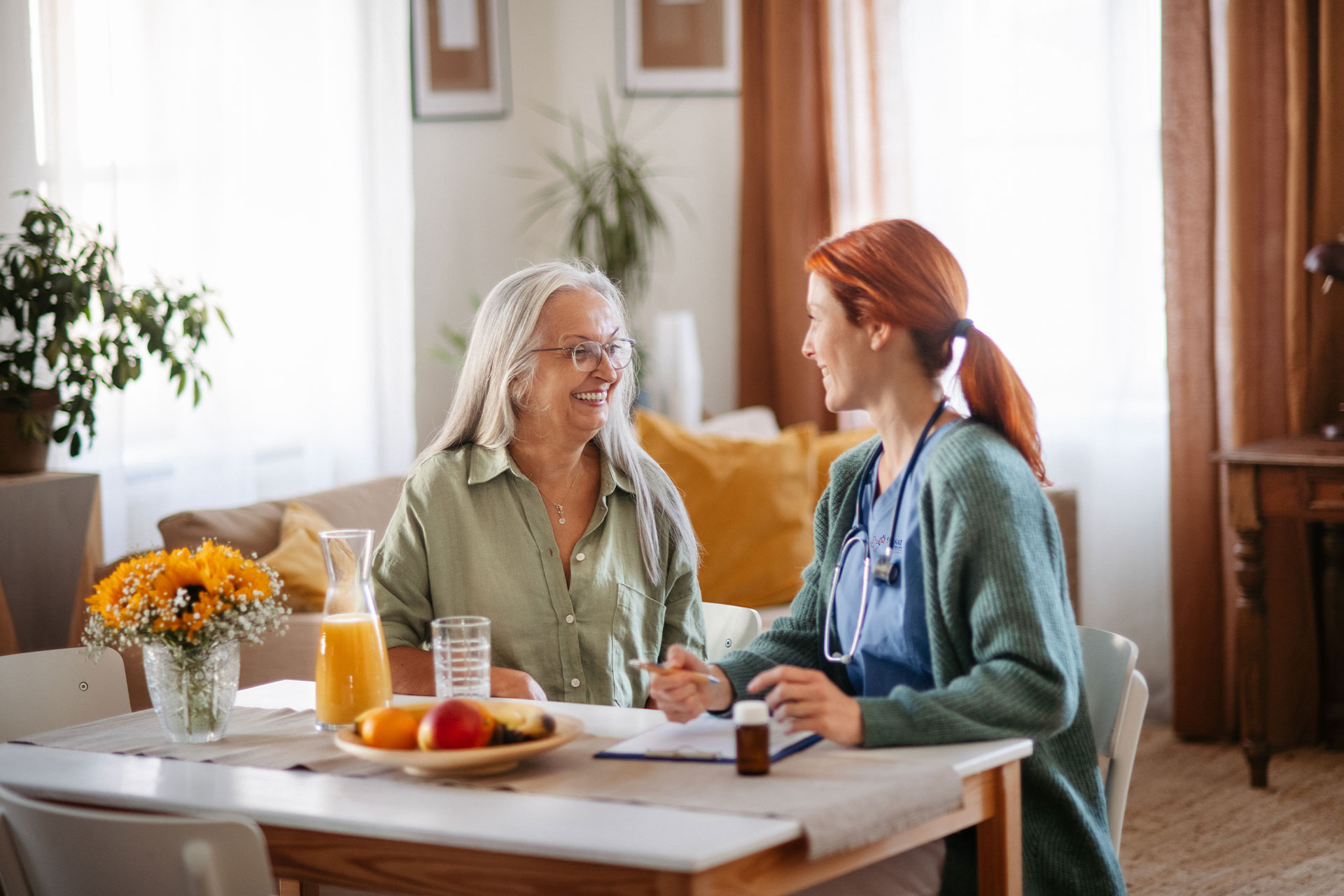 nurse helping educate patient about medications