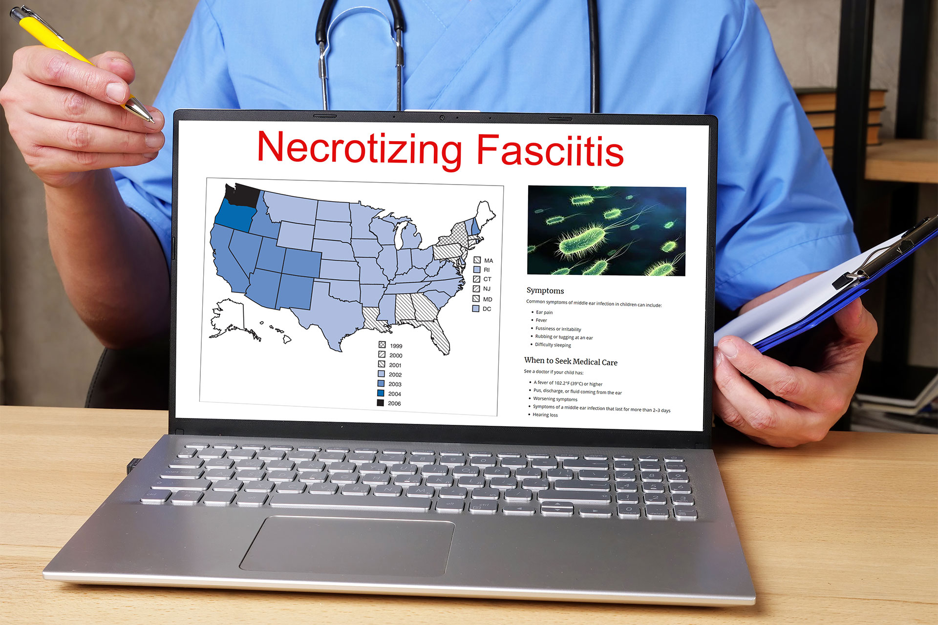 Hero-Necrotizing-Fasciitis-Computer computer showing necrotizing fasciitis info on computer