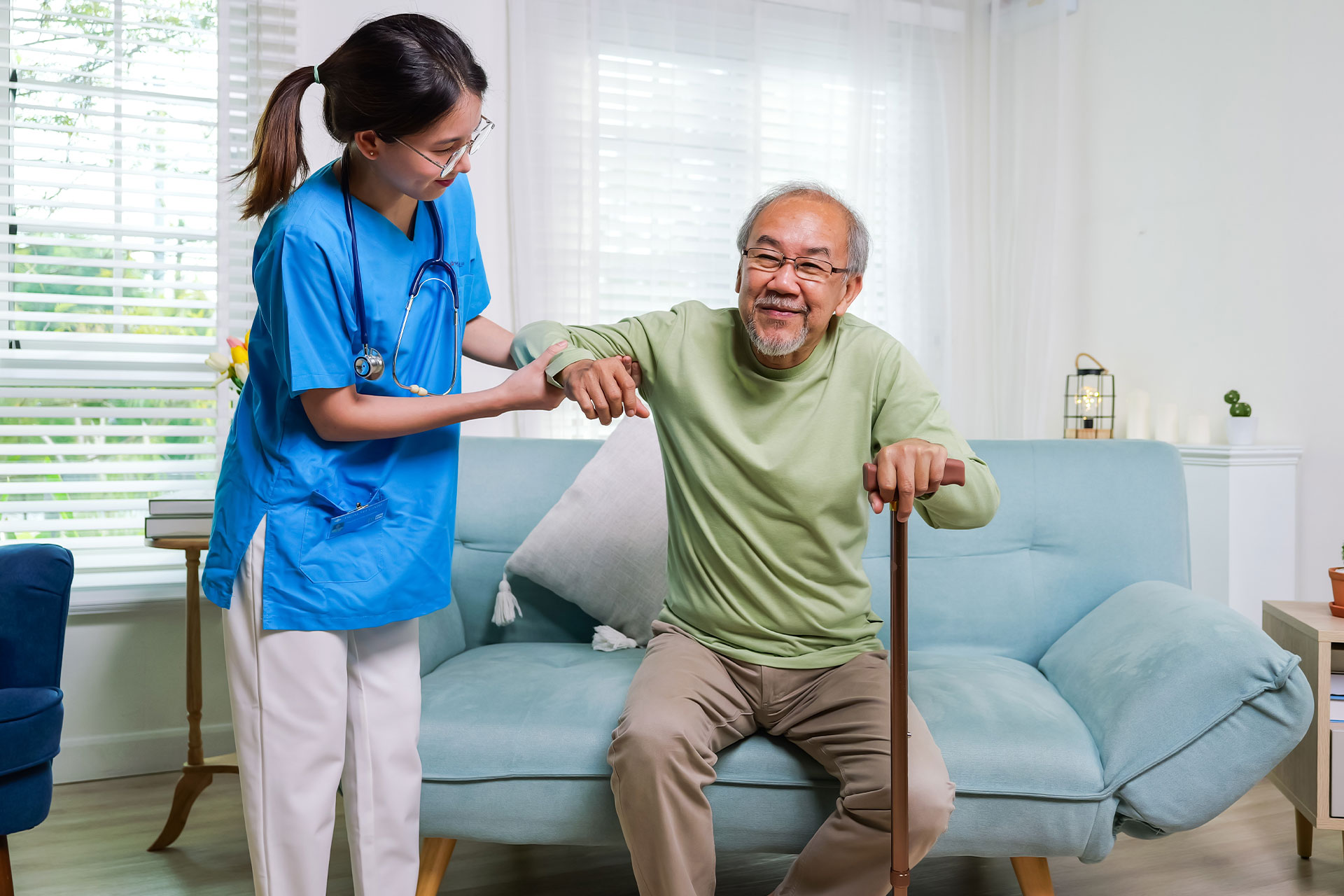 nurse helping patient stand