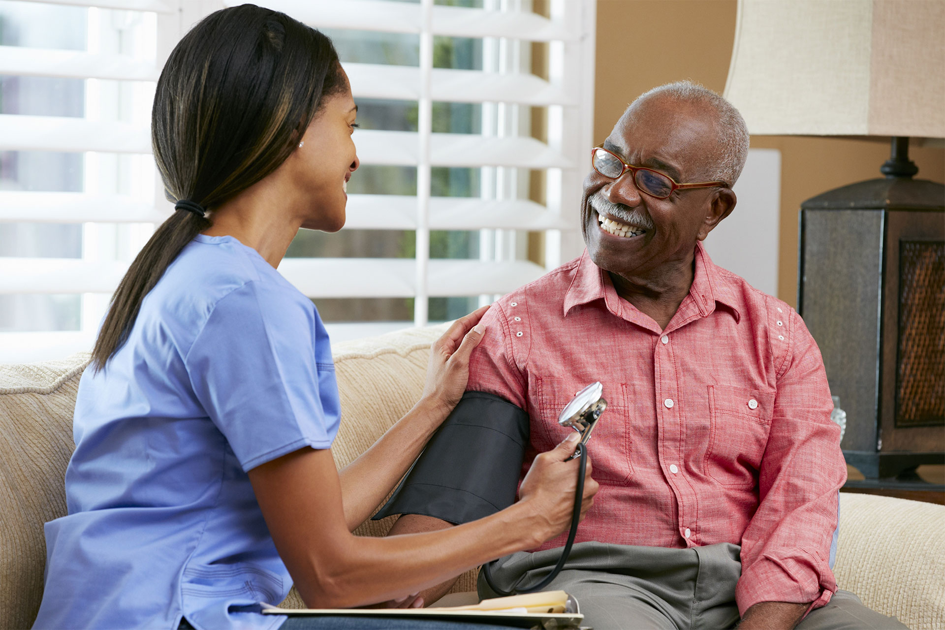 nurse taking patients blood pressure