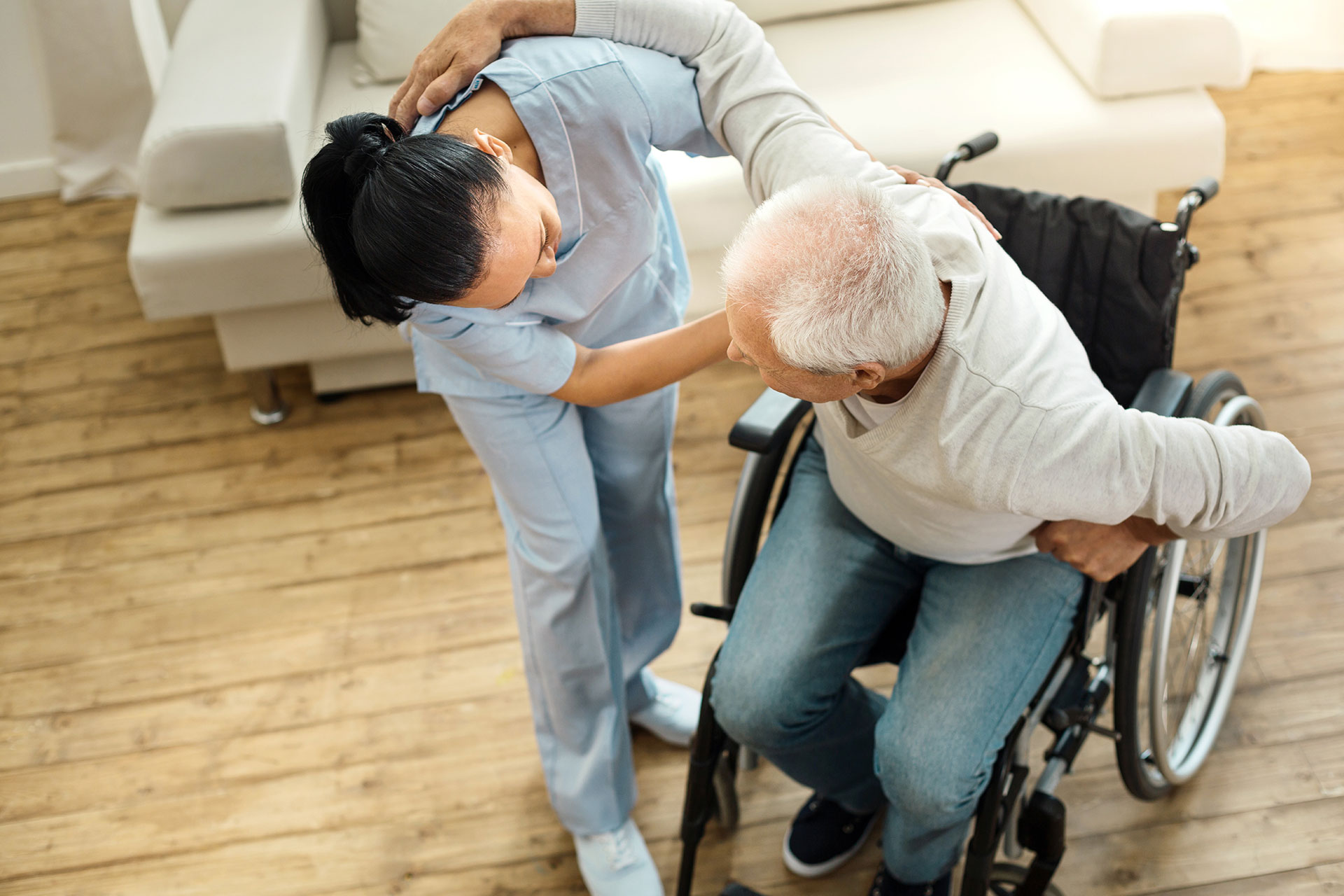 nurse helping paralysis patient