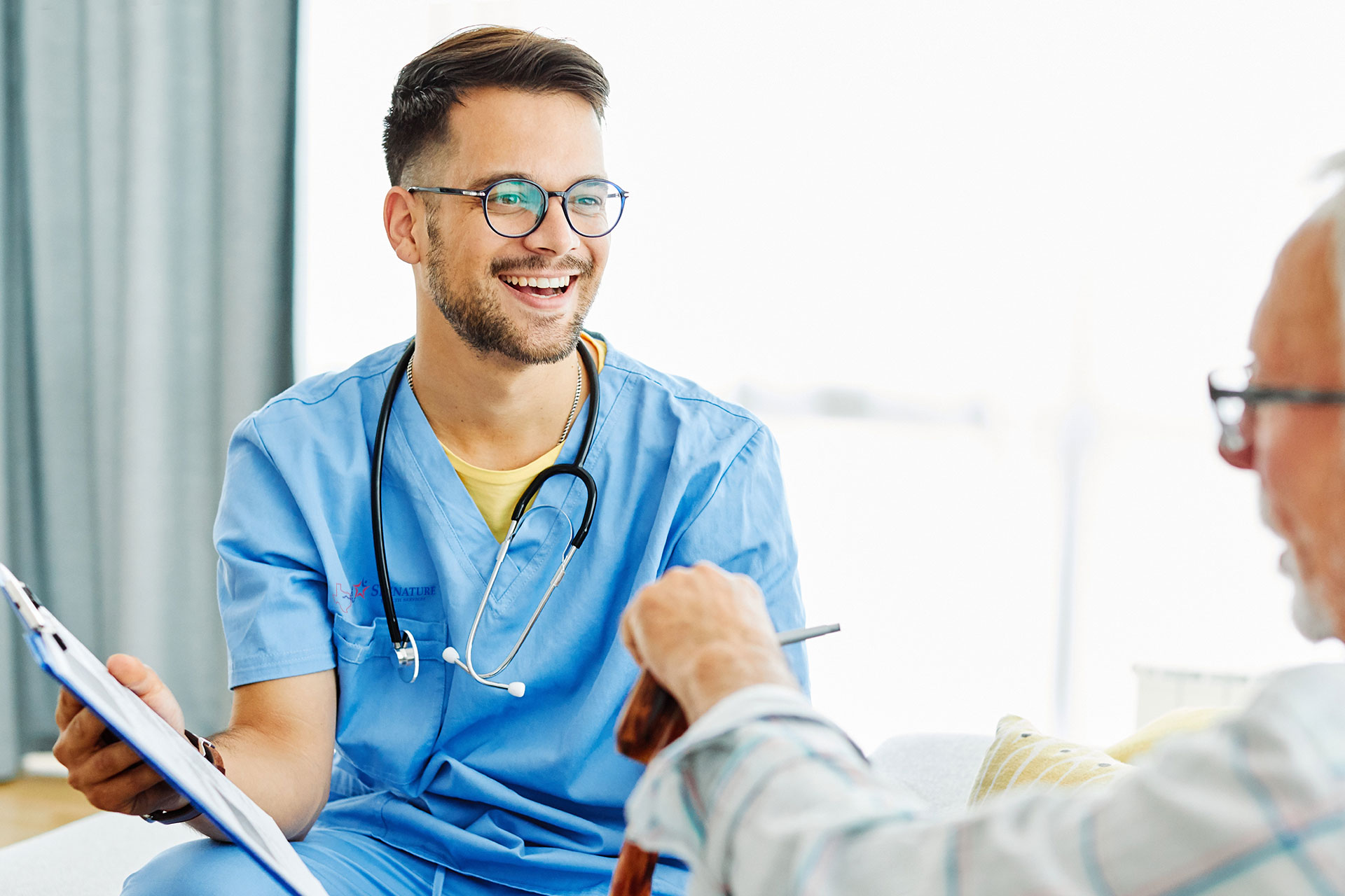 male nurse going over paper work with patient