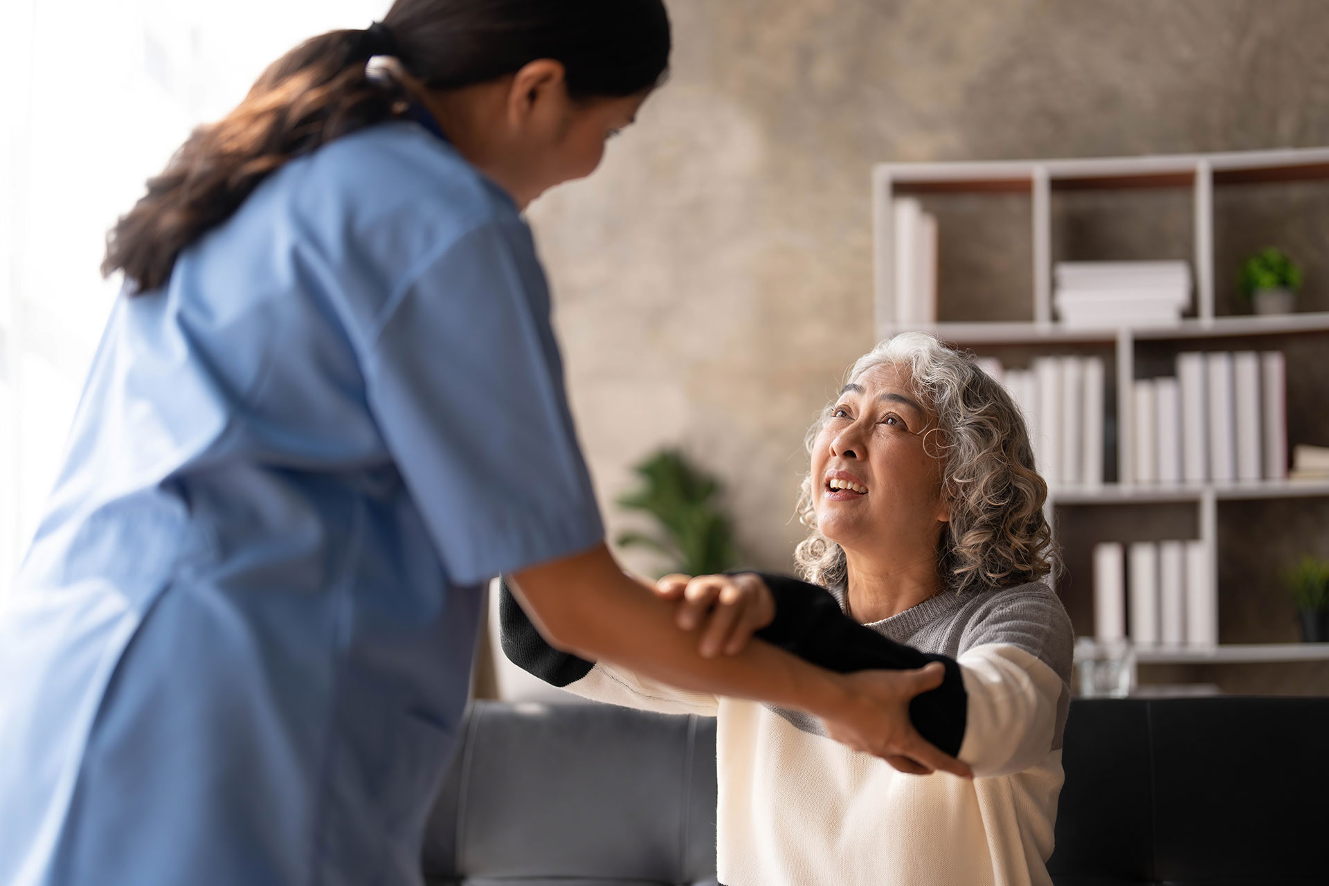 nurse helping patient stand